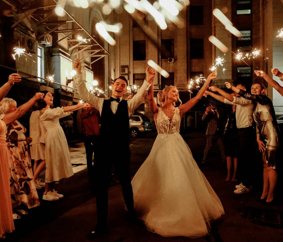 Professional DJ and MC engaging guests at a corporate or wedding event with high-energy music and professional hosting