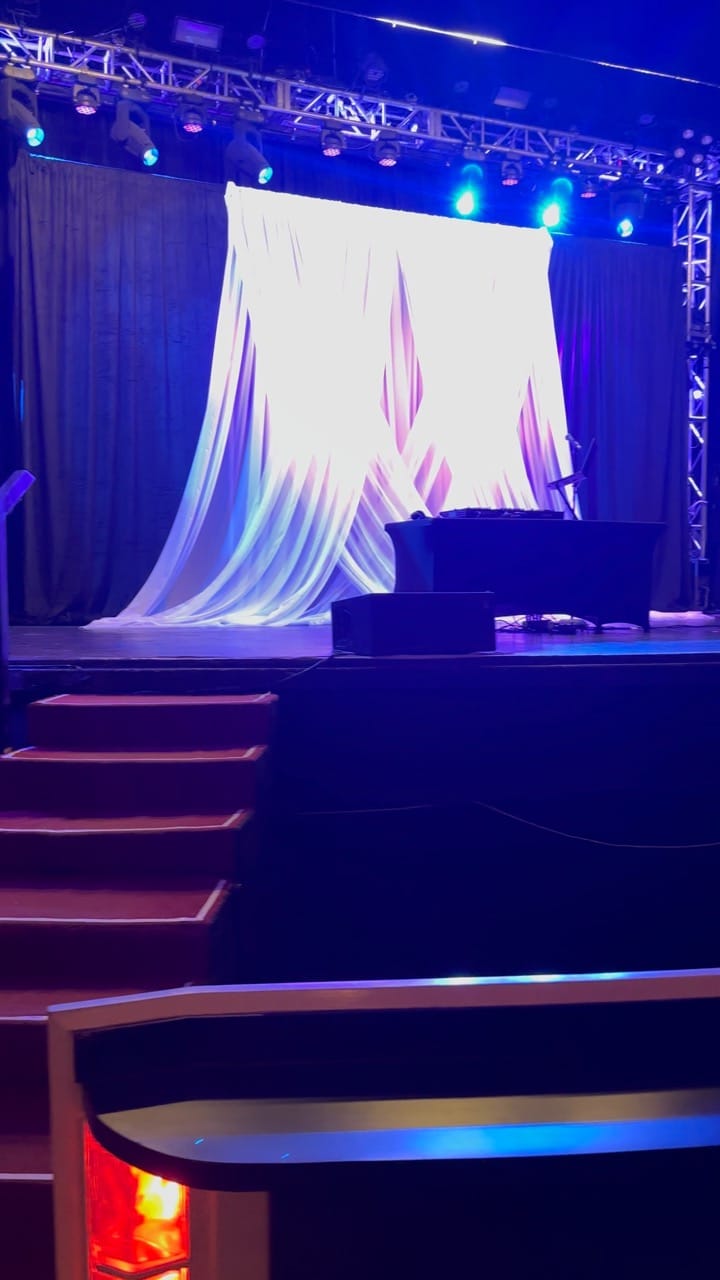 Guests playing Cosmic Bingo with neon lights and music at a corporate or social event in Dallas–Fort Worth