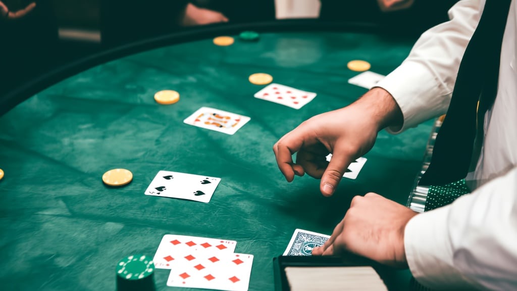 Professional DJ and MC engaging guests at a corporate or wedding event with high-energy music and professional hosting