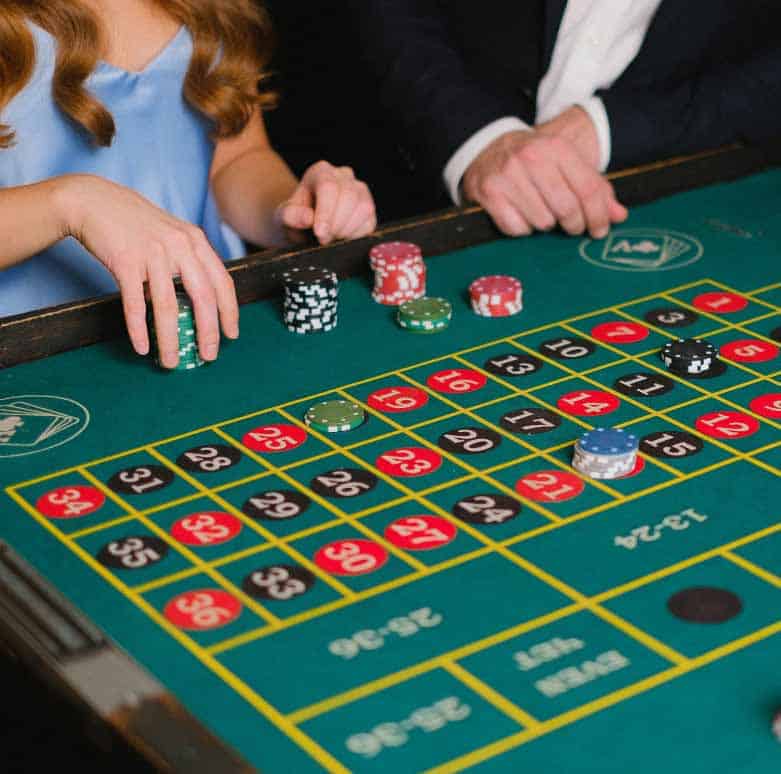 Casino night entertainment at a Southlake wedding event with elegant gaming tables and well-dressed guests