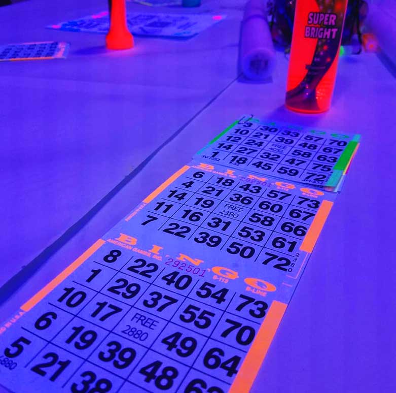 Cosmic Bingo and interactive games at a Southlake wedding event with high-energy lighting and engaged guests