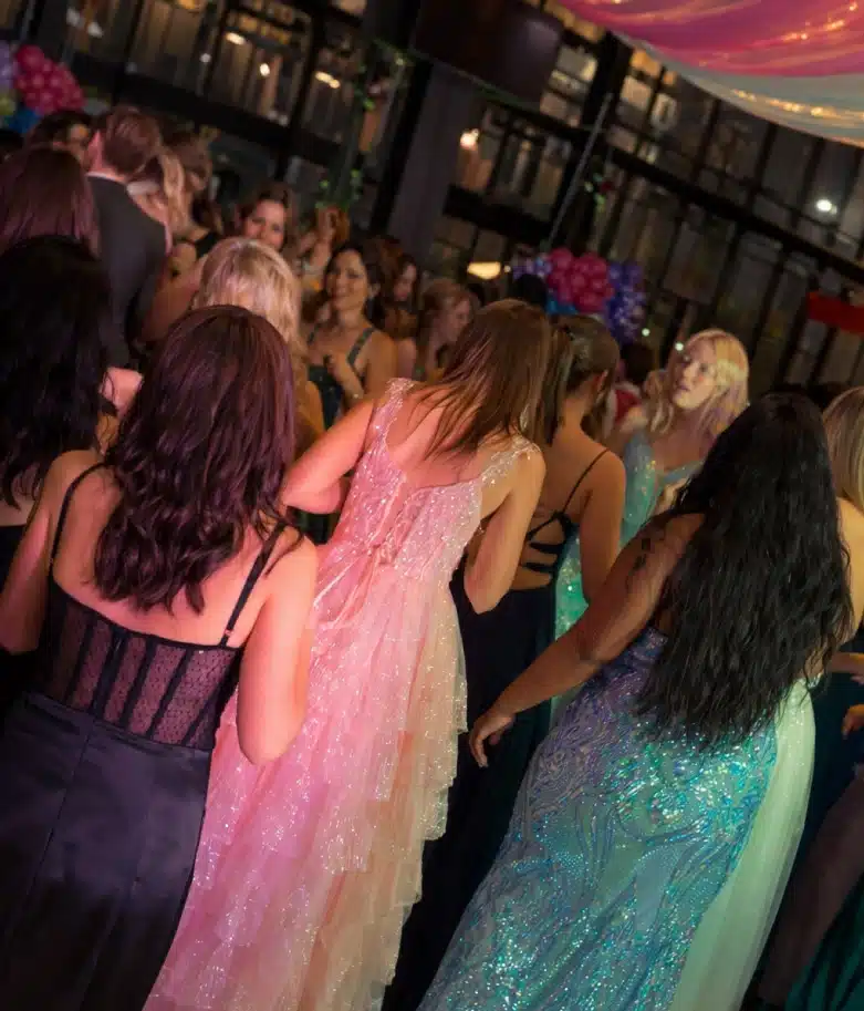 Professional DJ and MC engaging guests at a corporate or wedding event with high-energy music and professional hosting