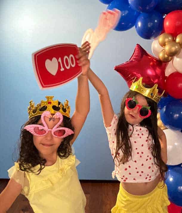 Kids enjoying a photo booth at a birthday party in Dallas<br />
