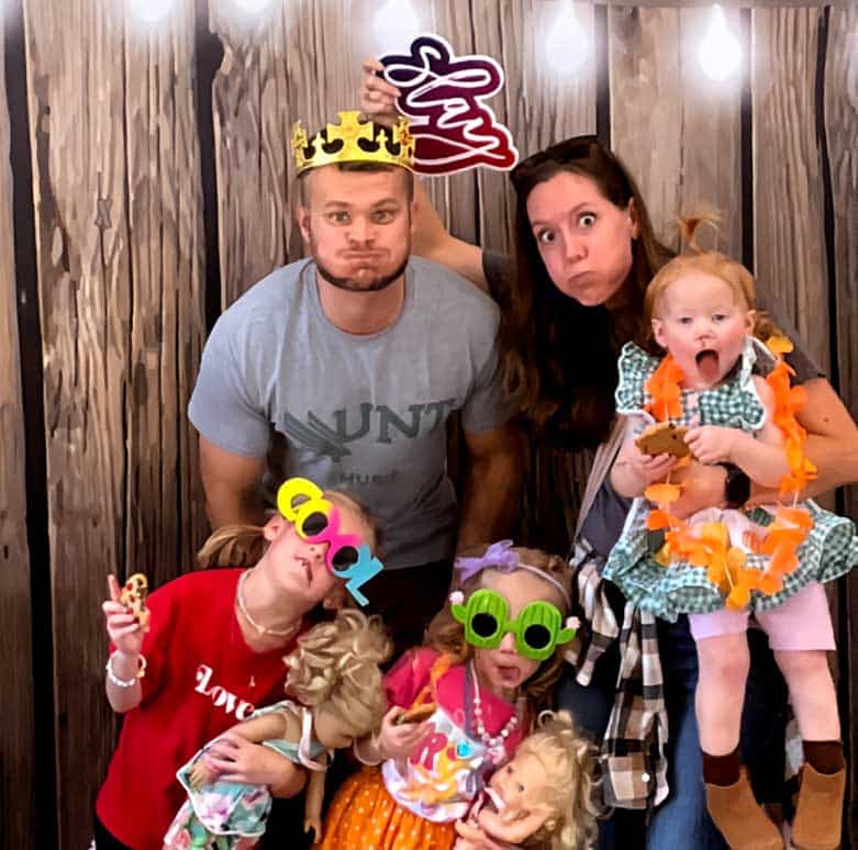 Professional DJ and MC engaging guests at a corporate or wedding event with high-energy music and professional hosting