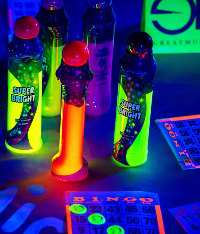 Cosmic Bingo wedding entertainment setup in Grand Prairie TX with neon bingo cards and highlighters