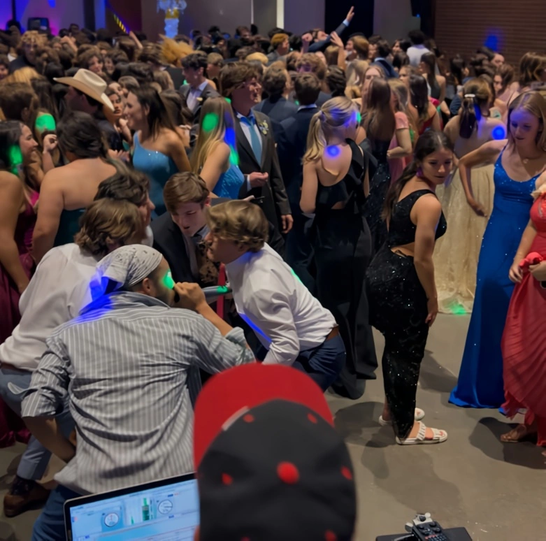Guests playing Cosmic Bingo with neon lights and music at a corporate or social event in Dallas–Fort Worth