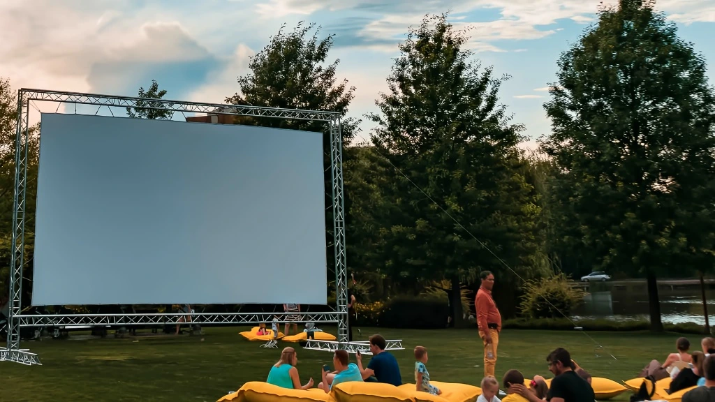 Outdoor movie night rental in Dallas Fort Worth with inflatable screen setup and professional outdoor event production