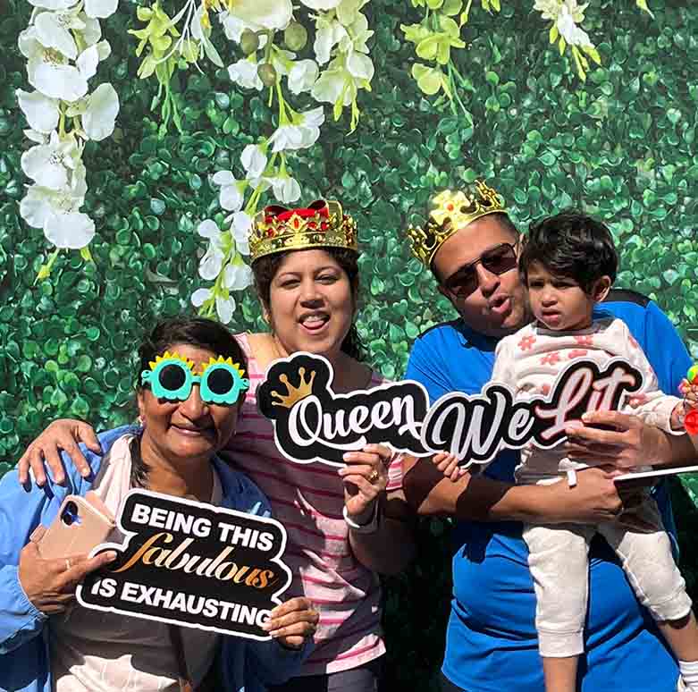 Corporate event attendees using a branded photo booth at a company celebration in Irving TX