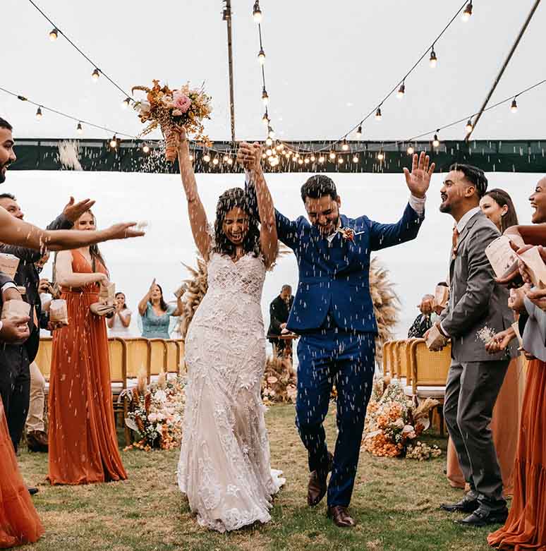 Joyful bridal party celebrating outdoors at a wedding venue in Irving, TX before the reception entertainment